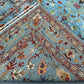 Folded handmade 5x7 wool Sultani rug – side view