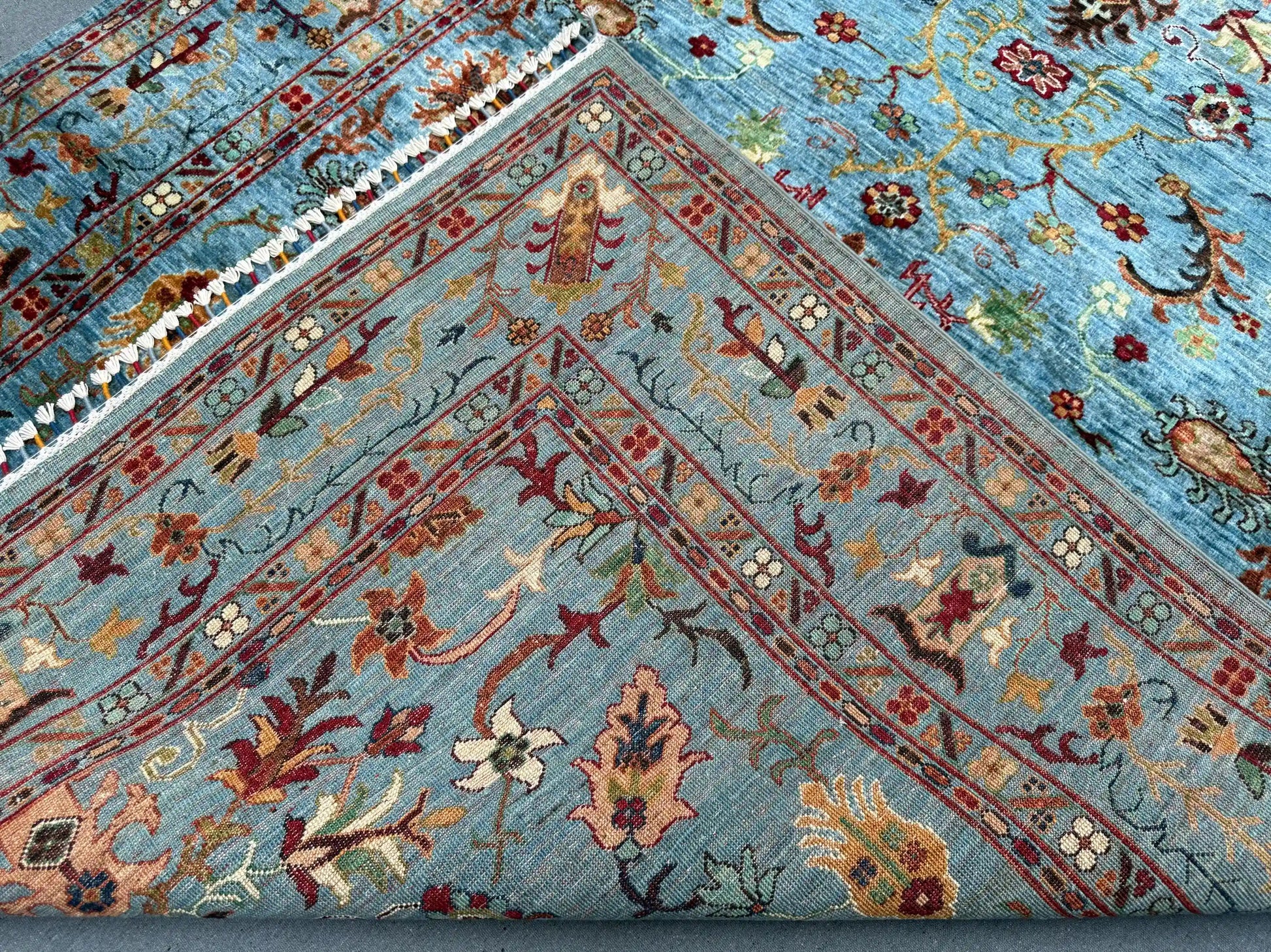Folded handmade 5x7 wool Sultani rug – side view
