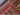 Folded handwoven wool shawl – tribal striped red, gold, and blue