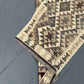 Folded wool Turkish runner rug – flatweave texture and artisan detail.