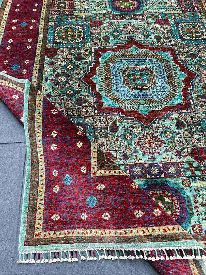 Folded Turkish Mamluk rug showing texture and knotting from side
