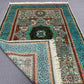 Folded view of handmade turquoise wool Mamluk rug – showing silk detail