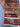 Folded view of handmade Afghan rug showing its thickness and color
