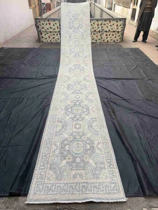 Full view of 15ft Turkish Oushak hallway runner in pastel tones