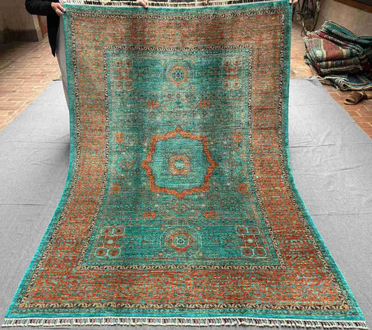 Full top view of Turkish handmade 6x8 Mamluk rug in green, orange, and turquoise