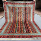 Full view of 5x6.6 floral striped Turkish kilim rug laid flat