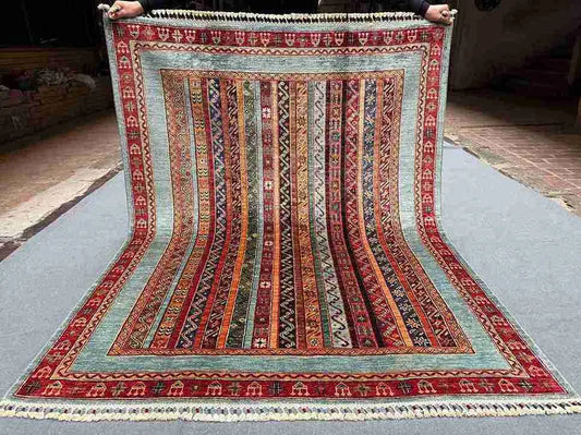 Full view of 5x6.6 floral striped Turkish kilim rug laid flat