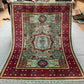 Full top view of 6x8 handmade Turkish Mamluk rug in red and teal