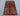 Top-down full view of handmade multicolor mini Afghan Oriental rug
