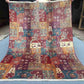 Top-down full view of handmade 5.1x6.7 Persian patchwork wool rug