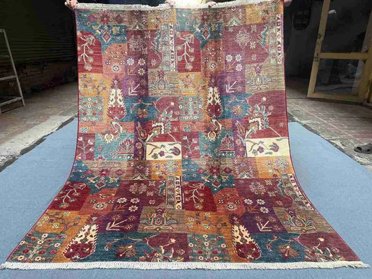 Top-down full view of handmade 5.1x6.7 Persian patchwork wool rug