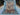 Top view of full 5.2x6.7 Persian Bakhtiari tribal wool rug with garden design