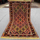 Full top view of handwoven 2.5x4.3 Turkish Afghan runner rug with red, green, and gold tribal geometric design