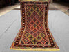 Full top view of handwoven 2.5x4.3 Turkish Afghan runner rug with red, green, and gold tribal geometric design