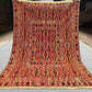 Full top-down view of 4.9x6.6 Turkish Afghan kilim rug with geometric tribal design in red and orange