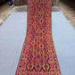 Complete view of 2.9x9.3 antique Turkish kilim runner with tribal design