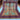 Full view of 8x10 handmade Oriental rug in red, blue, turquoise, and orange