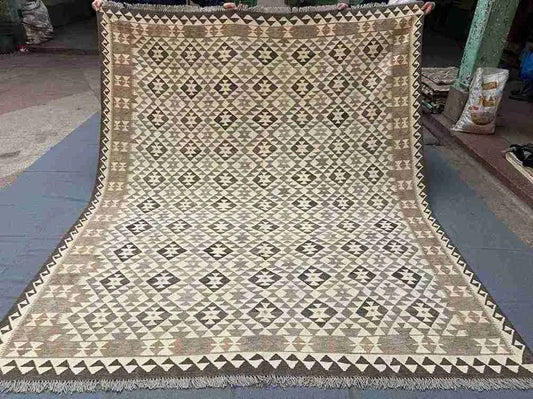 Full view of 8x10 Turkish Kilim wool rug – handmade flatweave in neutral and vibrant tones.