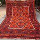 Full top-down view of handmade 8x12 Turkish Kilim rug – red and black geometric wool flatweave.