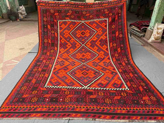 Full top-down view of handmade 8x12 Turkish Kilim rug – red and black geometric wool flatweave.