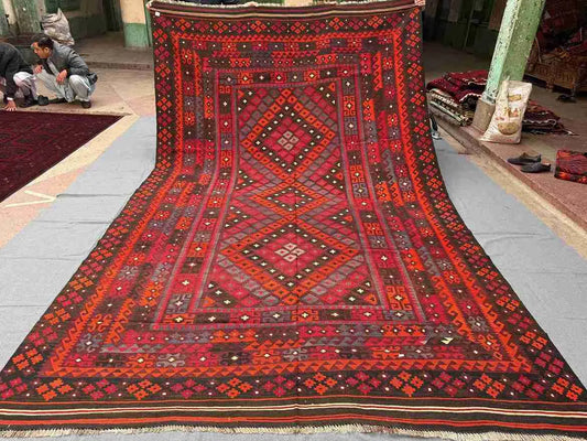 Full overhead view of 8x12 Turkish Kilim rug – vintage red and black oriental wool flatweave carpet.