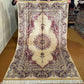 Full view of handmade 5x8 Persian-style silk oriental rug