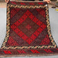 Full view of handwoven small red Afghan Kilim rug – geometric wool flatweave accent carpet.