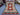 Full view of handmade 3.9x6 ft red & green Kilim rug with tribal design