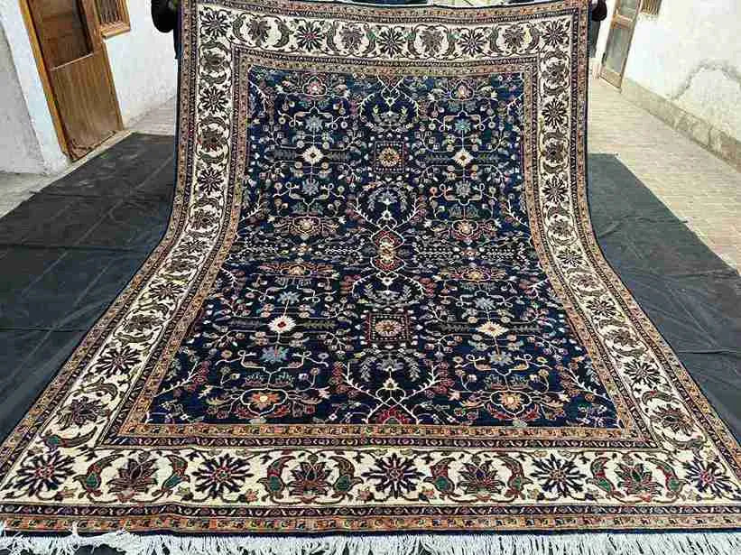 Full top-down view of navy and cream floral Chobi wool rug