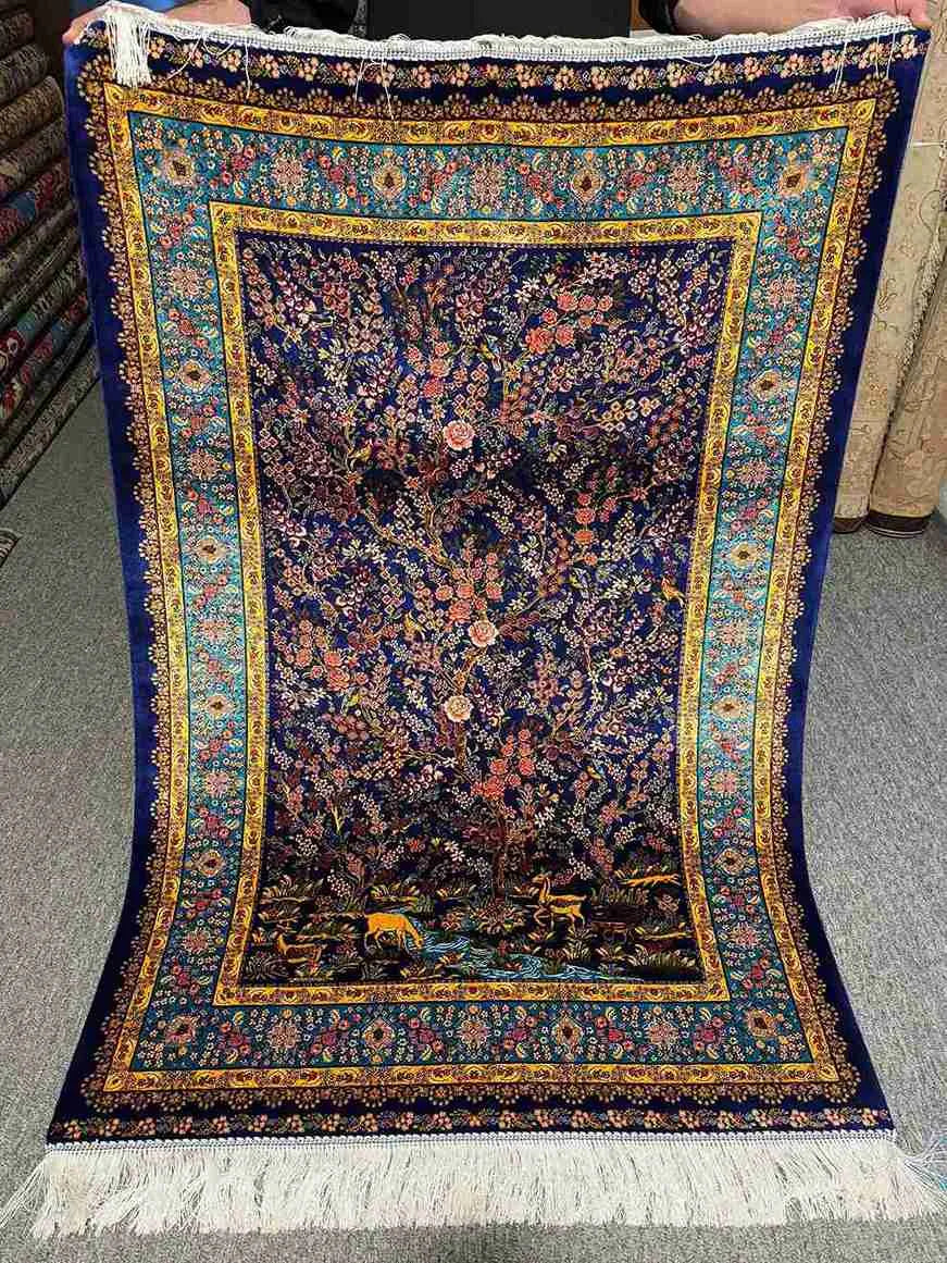 Full top-down view of handmade Persian Garden Silk Carpet