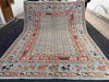 Full view of handmade Persian rug with horse motif