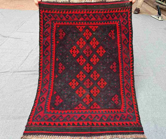  Full view of handmade small red Kilim rug – geometric wool flatweave, traditional and boho-style.