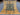 Full top-down view of green and gold square Ziegler Persian rug