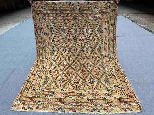 Full top view of 3.2x4.3 Turkish Afghan kilim rug with geometric tribal design in beige, blue, and red