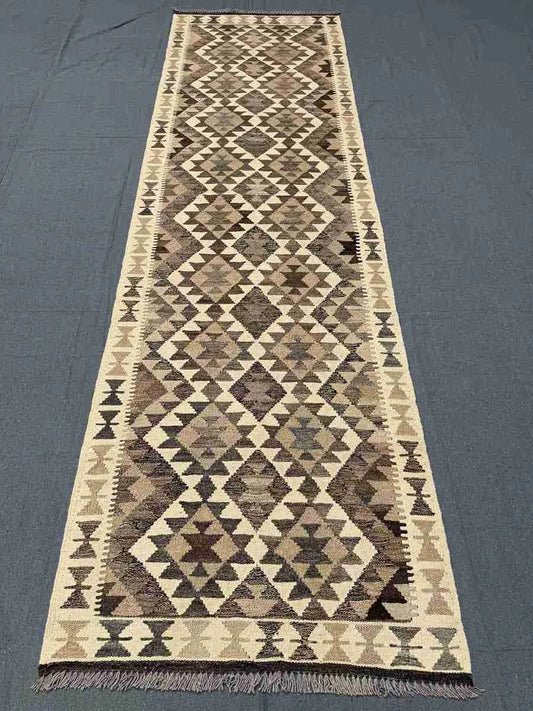 Full view of Turkish handmade Kilim runner rug – neutral tones with geometric design for hallway or rustic space.