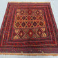 Geometric kilim rug on the floor showcasing tribal patterns