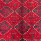Close-up of geometric tribal design on Afghan vintage wool rug