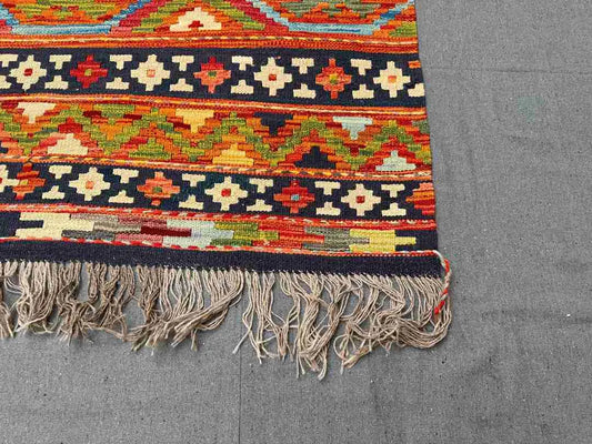 Corner detail of multicolor Khorjin Kilim rug – large handwoven geometric wool flatweave.