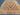 Close-up of geometric tribal pattern in pastel Afghan kilim rug