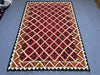  Floor view of red tribal kilim rug – geometric flatweave wool carpet