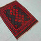 Floor view of small geometric Kilim rug – tribal red tones and handwoven wool texture.