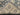 Folded corner view of Gray and Beige knotted Oushak rug