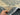 Handheld view of Gray and Beige Oushak Rug 9.4x11.7 ft – soft wool texture