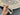  Close-up view of hand-holding Turkish wool floral rug – 3.11x5.9 ft
