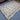 Floor-level angle view of gray Kilim wool area rug
