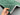 Handmade Green Gabbeh Rug 2.8x3.7 ft in hands – front view of wool Persian-style carpet
