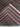 Folded hand-knotted Oriental rug with red and green floral design