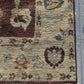 Corner close-up of hand-knotted Turkish Oushak wool rug with intricate patterns