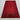 Handmade red area rug placed in traditional room setup