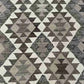 Texture detail of handmade Kilim flatweave rug – rustic and knotted hand finish.